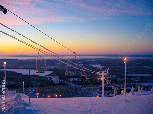 Ski-lifts in a sunset in snowy Finnish Lapland