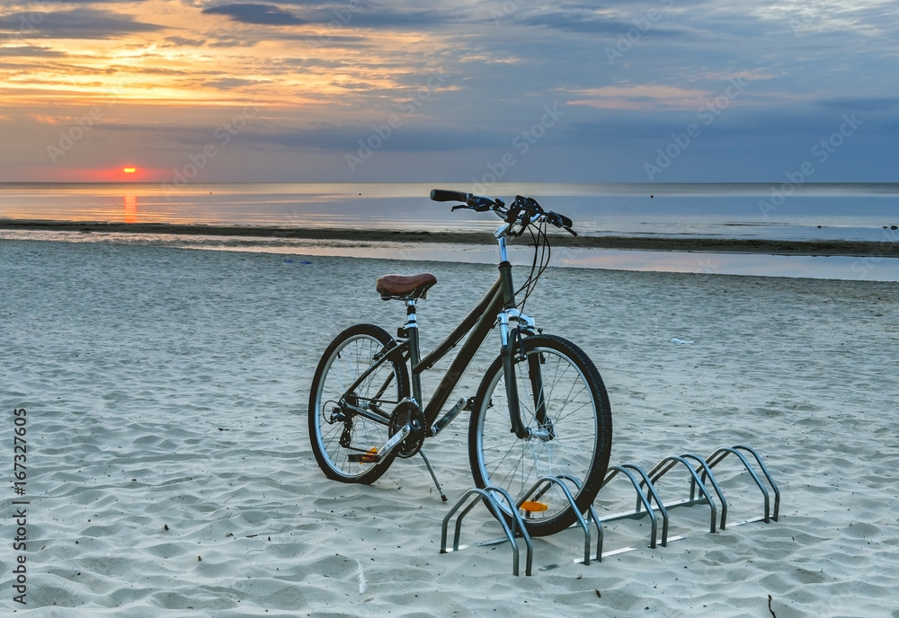 Bicycle at sandy beach of Jurmala – famous public domain resort in Latvia, Europe