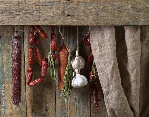 Obraz na płótnie Sausages with rosemary , garlic and pepper.