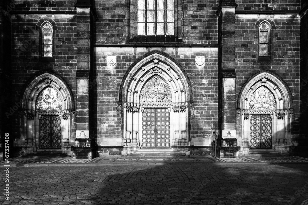 Gothic style entrance portal of Basilica of Saint Peter and Paul in Vysehrad, Prague, Czech Republic. Black and white image Gothic style entrance portal of Basilica of Saint Peter and Paul in Vysehrad, Prague, Czech Republic. Black and white image