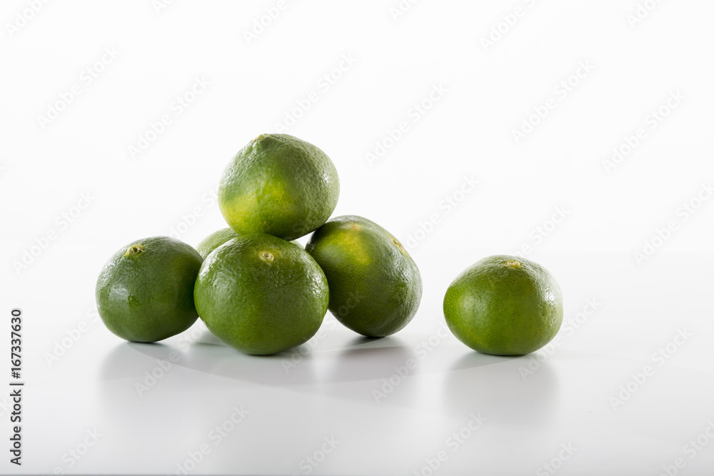 Delicious tangerines are showing off front of the white background Delicious tangerines are showing off front of the white background