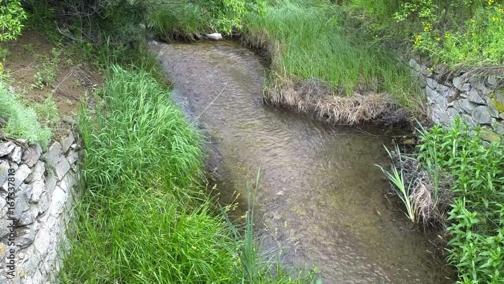 Water stream flowing over some rocks. Water stream flowing over some rocks.