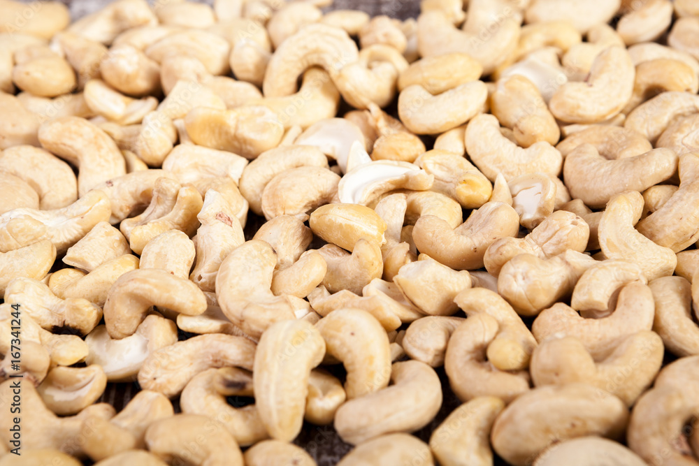 Cashew nuts on wooden background in studio photo. Raw healthy food Cashew nuts on wooden background in studio photo. Raw healthy food