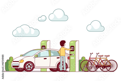 Man charging electric car at power station