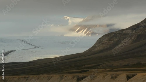 nordenskiold glacier seen from billenfjorden in svalbard during midnight sun