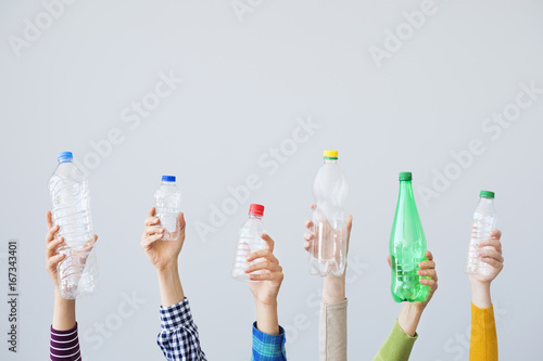 Hands holding plastic bottle