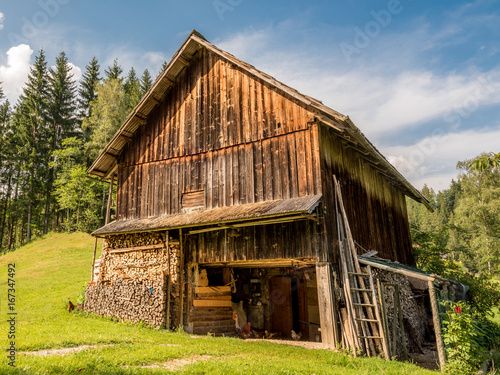 Old wooden village barn in the hills
