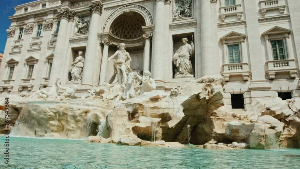 The famous Trevi Fountain in Rome. Popular place among tourists from all over the world. Slow motion shot The famous Trevi Fountain in Rome. Popular place among tourists from all over the world. Slow motion shot
