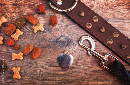 Fototapeta Naklejka Na Ścianę i Meble -  Pet accessories on wooden background. Top view. Pets and animals concept