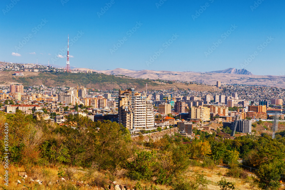 Fototapeta premium Yerevan, Armenia - 26 September, 2016: A view of Yerevan from Genocide memorial in sunny day and view on Ararat