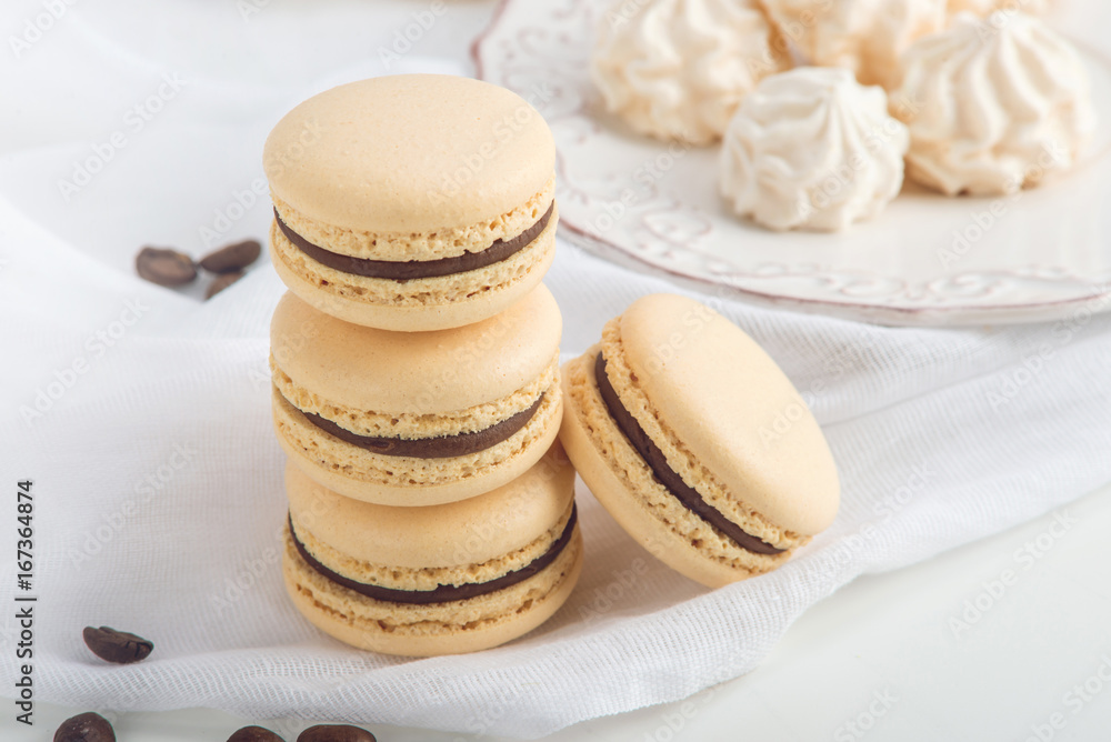 Coffee macarons with chocolate. French delicate dessert for Breakfast Coffee macarons with chocolate. French delicate dessert for Breakfast