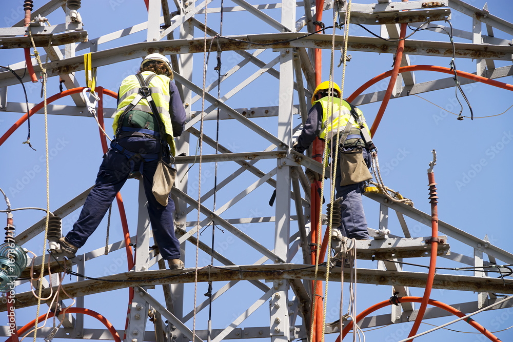 electric tower of  high voltage Is disassembled by specialists  workers