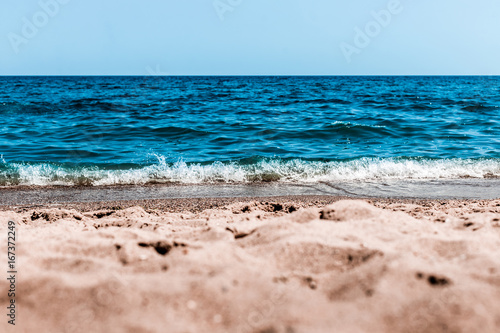 Sea view from tropical beach with sunny sky. Sea travel and holiday. Selective focus