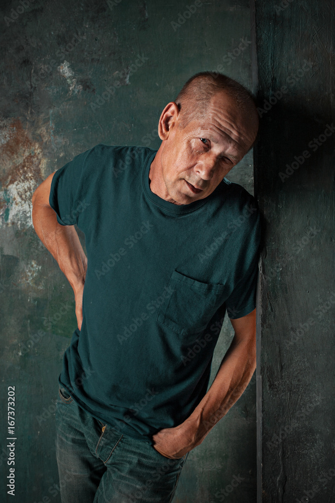 Worried mature man standing at studio Worried mature man standing at studio
