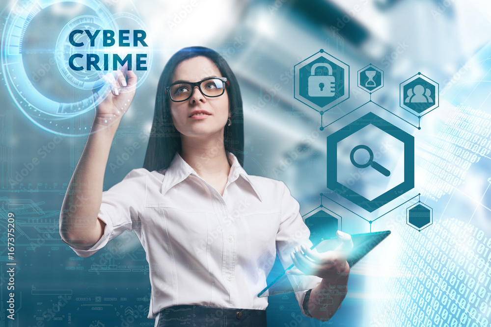 The concept of business, technology, the Internet and the network. A young entrepreneur working on a virtual screen of the future and sees the inscription: Cyber crime The concept of business, technology, the Internet and the network. A young entrepreneur working on a virtual screen of the future and sees the inscription: Cyber crime