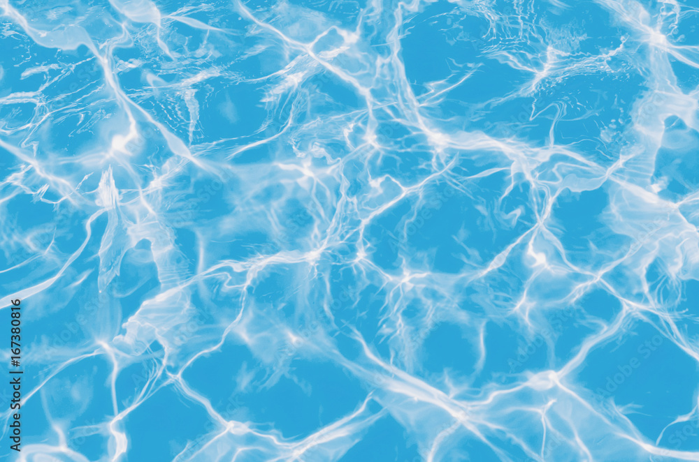 Obraz premium Solar flares on the blue water in the pool