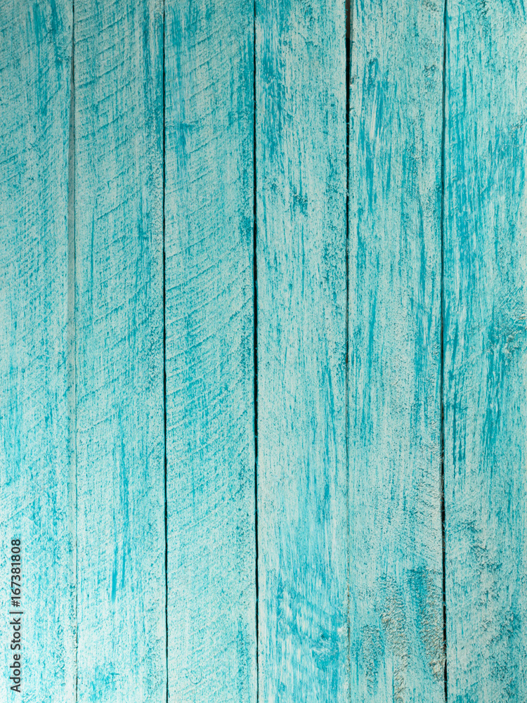 Painted in blue and white color wall with wooden planks.