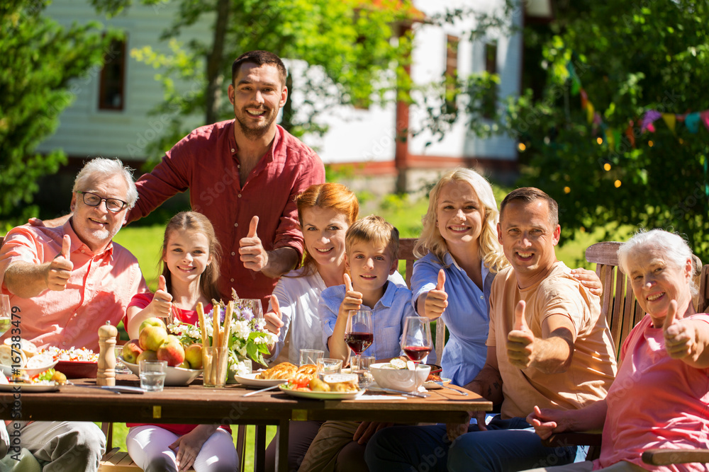Fototapeta premium happy family having dinner or summer garden party