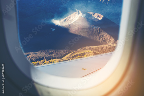 Mount Rinjani Volcano, Indonesia as seen through window of an aircraft.