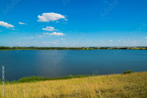 Summer landscape with lake in central Russia in August. Front focus