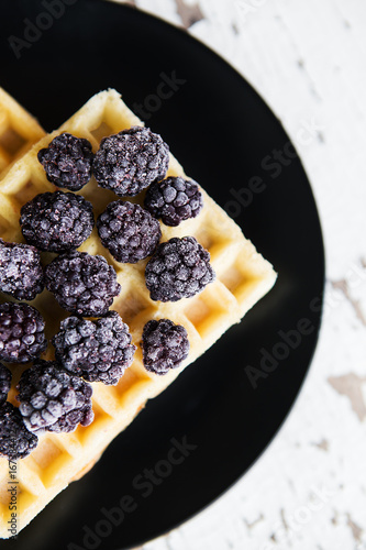 Delicious and beautiful Belgian waffles with blackberries  close-up.