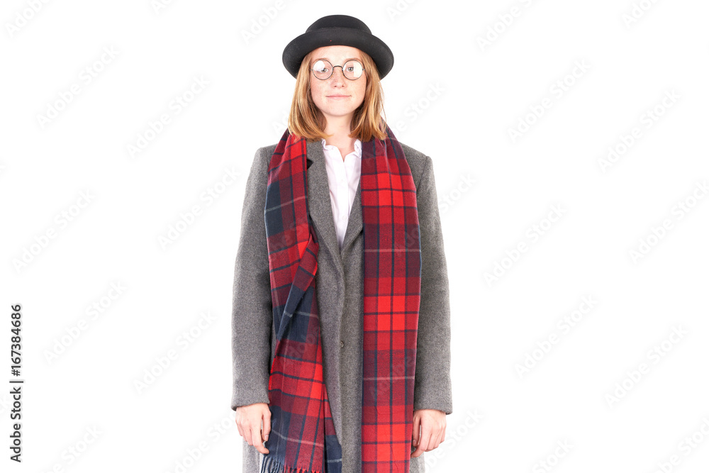 Portrait of teenage hispter girl wearing gray overcoat and black hat isolated on white Portrait of teenage hispter girl wearing gray overcoat and black hat isolated on white