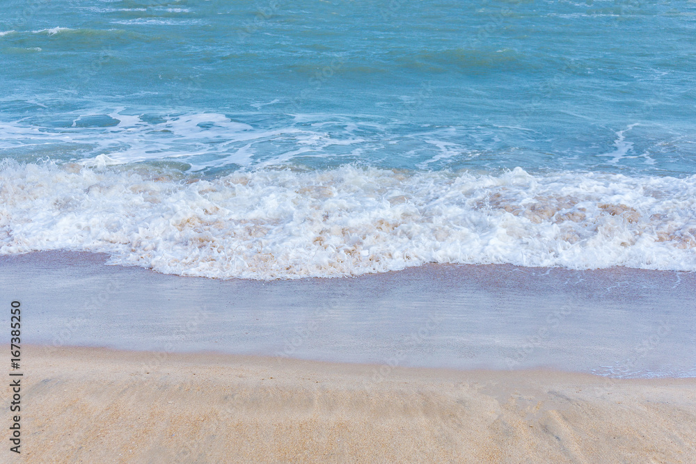 Soft wave of ocean on the sandy beach