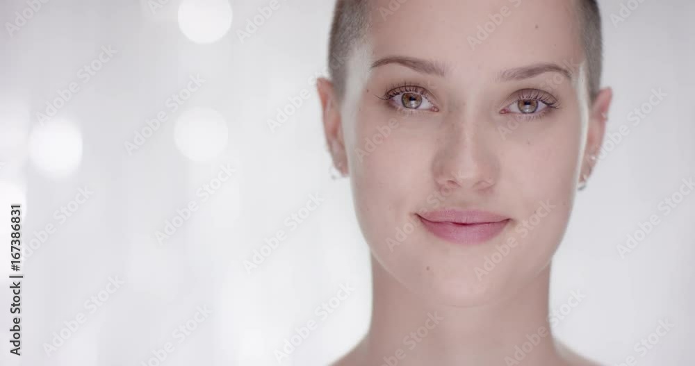 Woman with short hair looks up in to the camera Woman with short hair looks up in to the camera