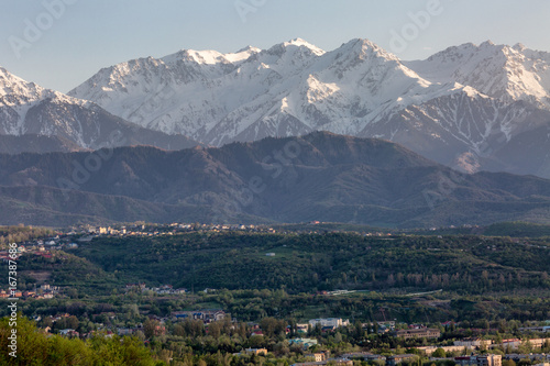 A beautiful mountain landscape, a small village in the summer mountains