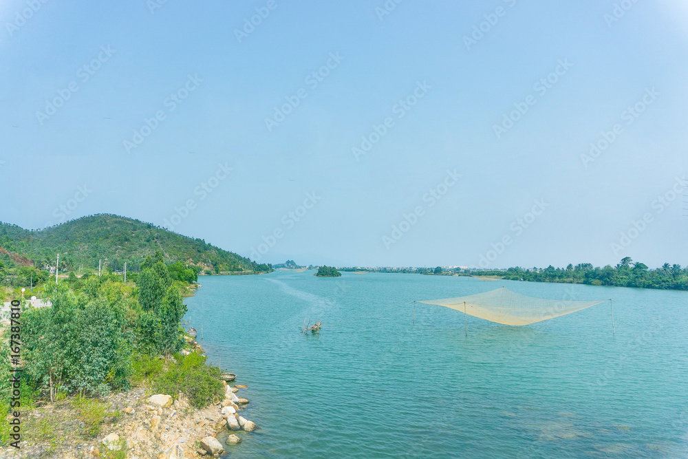 Beautiful landscape with river and fish net