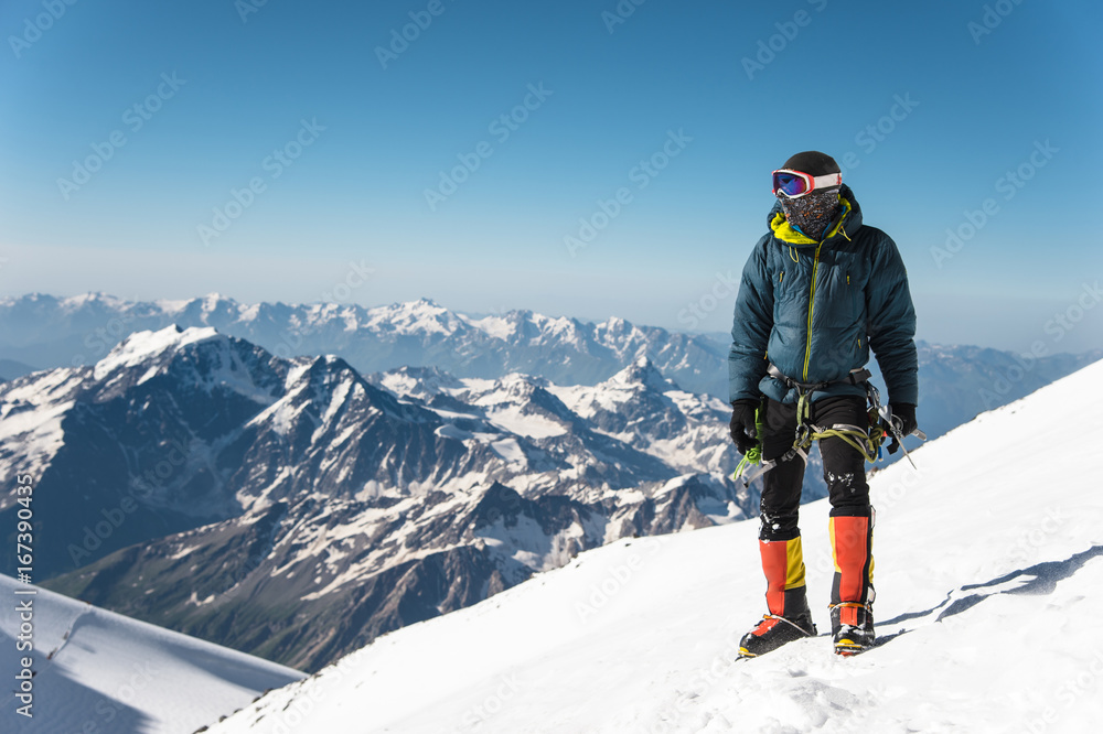 Professional guide - climber on the snow-covered summit of Elbrus sleeping volcano