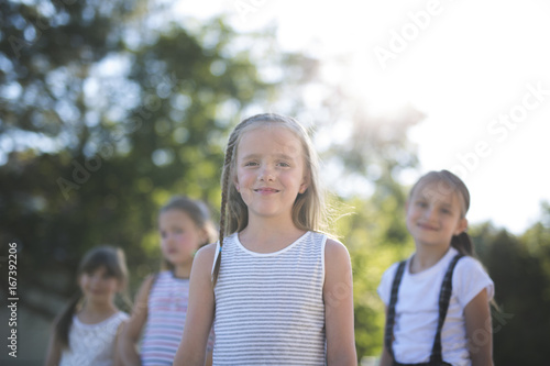 cheerful school age child play on playground school