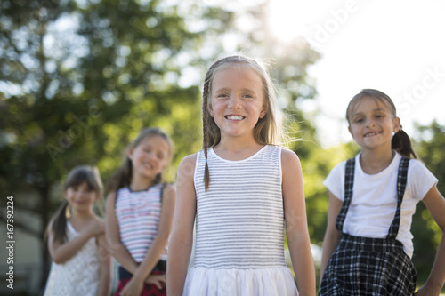 cheerful school age child play on playground school