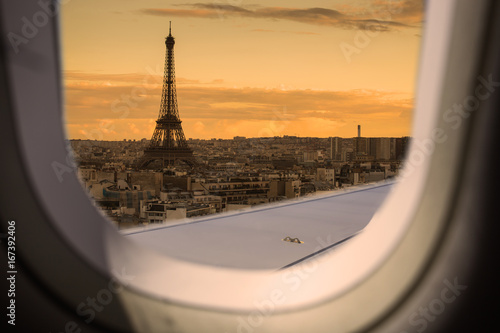 Eiffel as seen through window of an aircraft. © Khritthithat