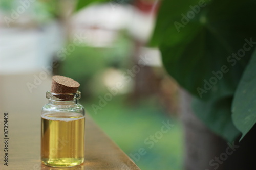 Fototapeta Naklejka Na Ścianę i Meble -  spoiled oil in the bottle open bottle with natural background