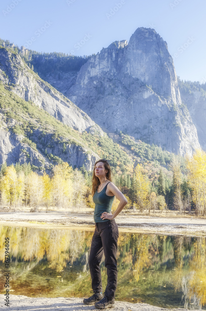 Hiking girl in Yosemite National Park in autumn time