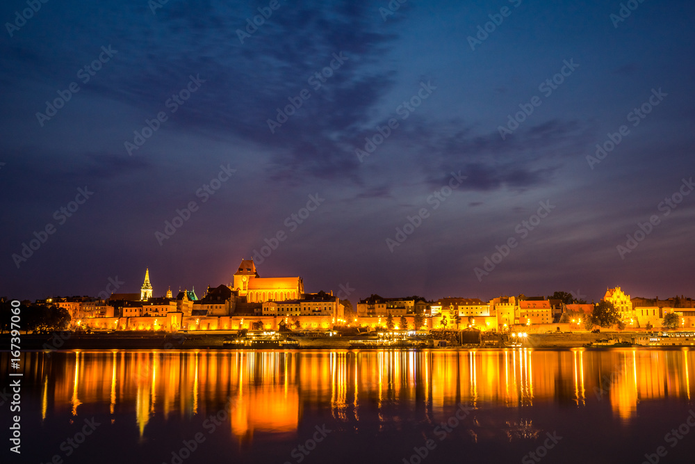 Night view of Torun city and Vistula river, Poland
