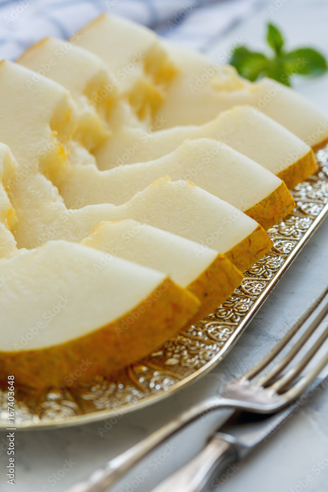 Dish with slices of melon closeup. Dish with slices of melon closeup.