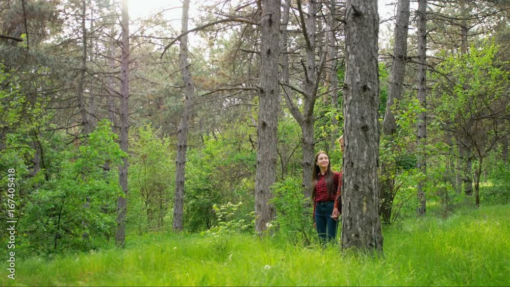 Beautiful elegant couple in love, walking in the wood, romantic date. Wide shot. Beautiful elegant couple in love, walking in the wood, romantic date. Wide shot.