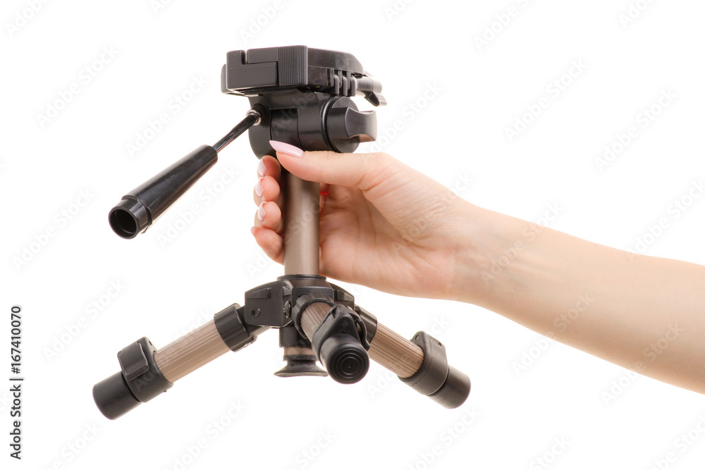 Small tripod in a female hand Small tripod in a female hand