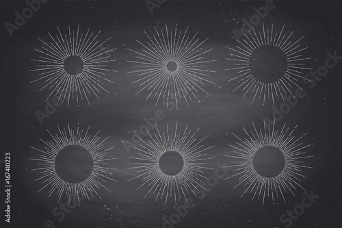 Set of light rays, sunburst and rays of sun. Design elements, linear drawing, vintage hipster style. Light rays sunburst for retro label, emblem on black chalk board. Vector Illustration