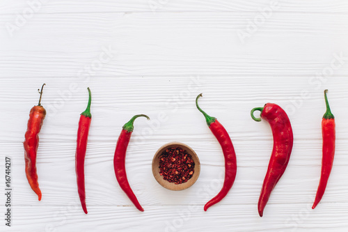 Chili red on a wooden background.