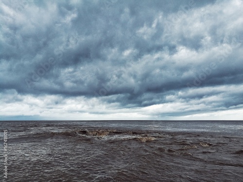 Stormy clouds and filthy sea