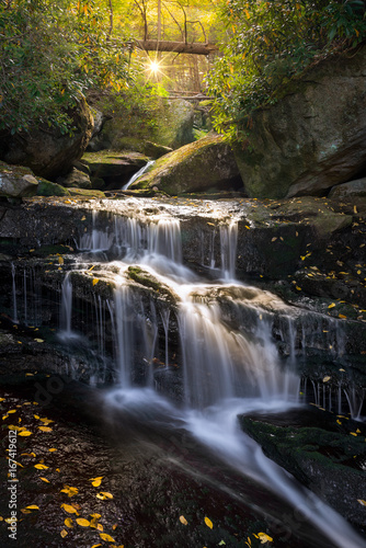 Fototapeta Naklejka Na Ścianę i Meble -  Fallen leaves and cascading water, Blackwater Falls State Park, West Virginia