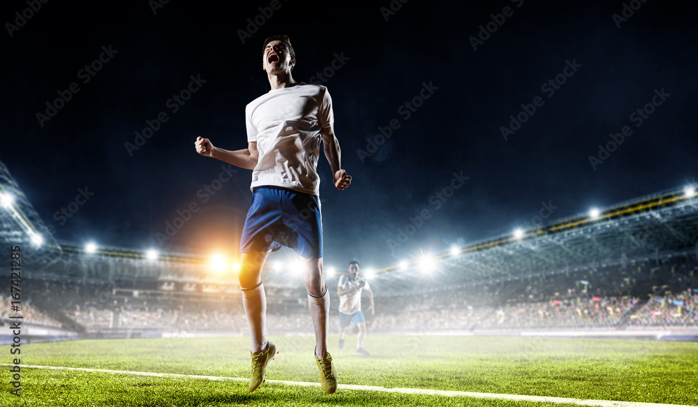 Obraz premium Soccer player at stadium. Mixed media