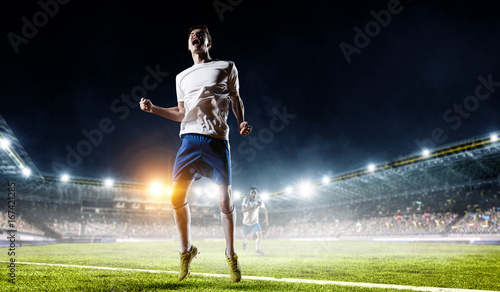 Soccer player at stadium. Mixed media © Sergey Nivens
