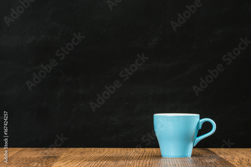ceramic blue coffee cup with empty blank copyspace
