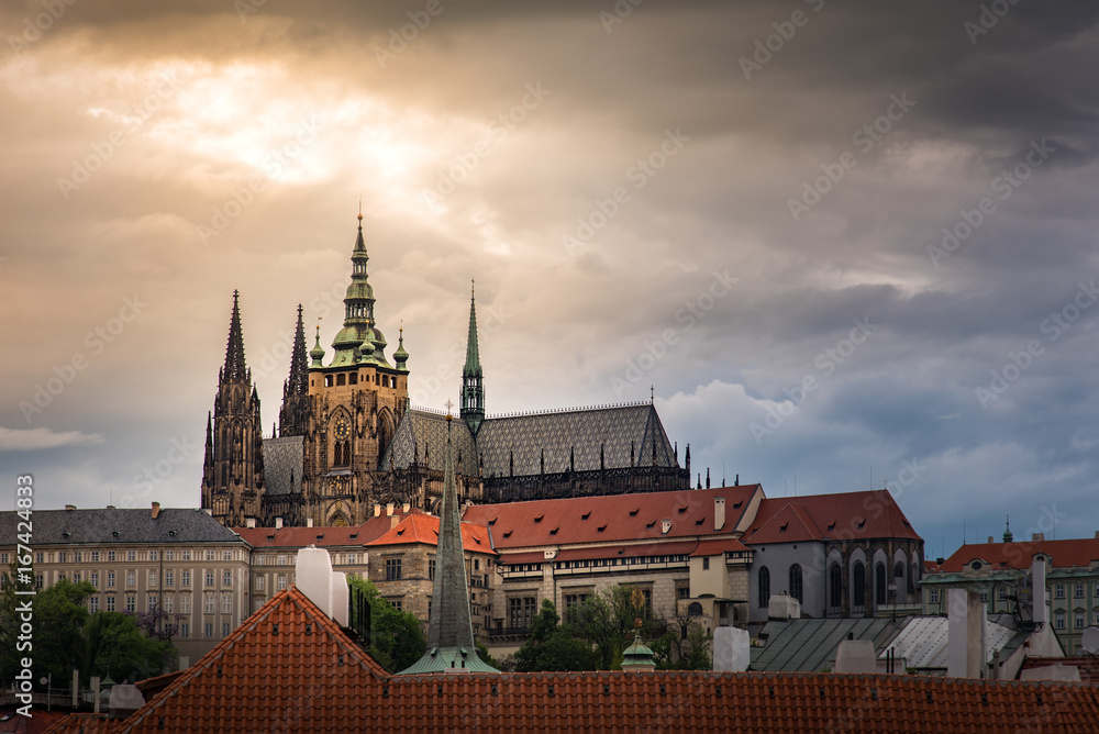 Prague Castle with cloudy sunset .