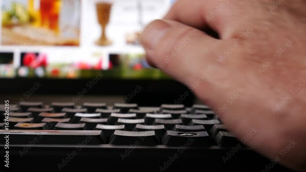 A man is using a computer. No movement Camera.