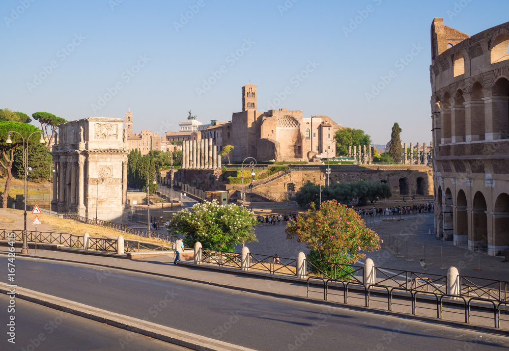Rome, Italy - The archeological ruins with Colosseum in historic center of Rome, named Imperial Fora, in a sunday morning.
